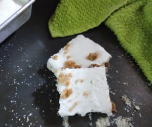 Creamy Key Lime Bars sliced with a green cloth behind them