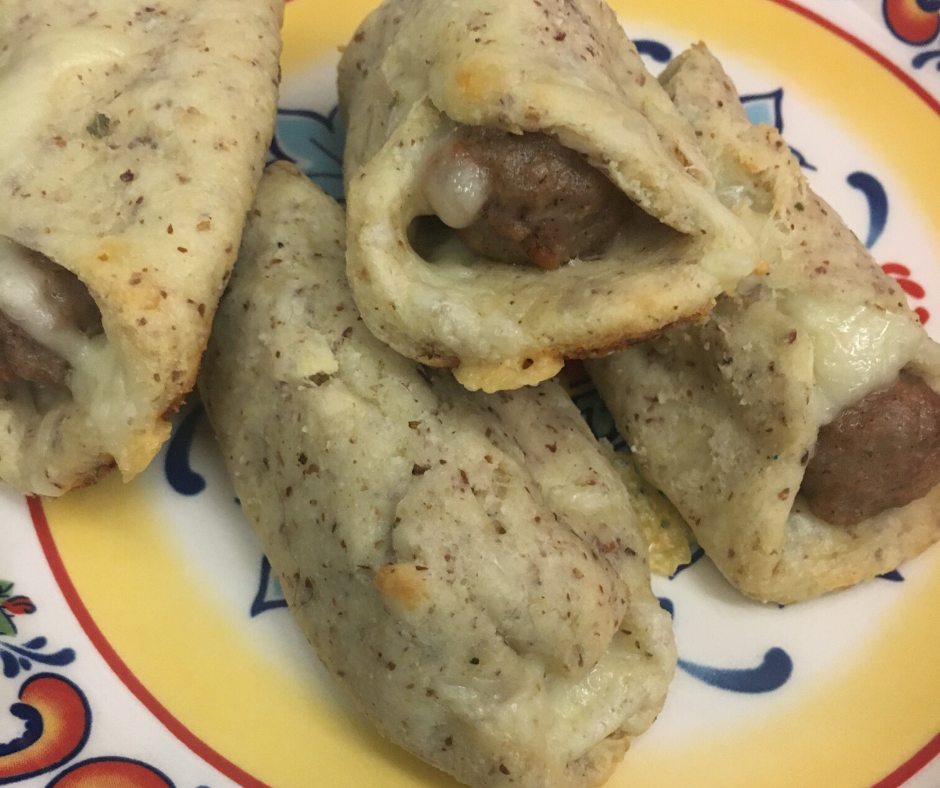 Fathead Pigs in a Blanket on a fiesta type plate with bright colors