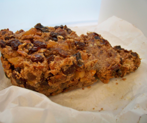 Grain-Free Refined Sugar-Free Fruitcake sliced on white parchment paper