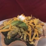 Breakfast Taco Bowls on a white plate with a red background