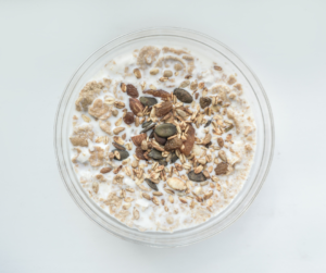 Pale background with image of a bowl of oats in milk