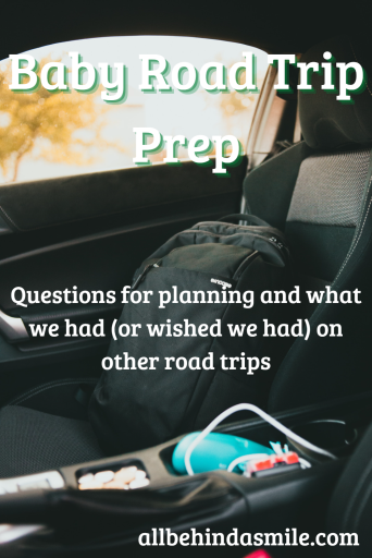 Black backpack in passenger seat of vehicle with text baby road trip prep questions for planning and what we had (or wished we had) on other road trips