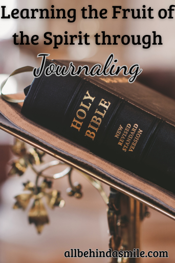 Image of a Bible on a stand with the text: Learning the Fruit of the Spirit through Journaling
